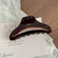 Large acetate hair claw clip with gold letters, dumpling hollow design, detailed hair styling accessory. - L / Dark Brown