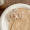 Medium acrylic hair claw clip with pearl accent, wavy design elegant hair accessory for women. - Light Pink