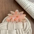 Close-up of a large pink acetate flower hair claw clip, elegant and fresh hair accessory design. - Iridescent Orange