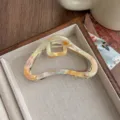 Elegante pinza de pelo de acetato con forma de nube irregular y detalle de metal para mujeres. - Arcoíris