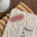 Close up detail of pink water drop acetate hair clip, cute side bang hairpin for women. - Light Pink