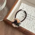 Retro acetate tortoiseshell button hair tie detail view, showcasing elegant daily style. - Light Leopard