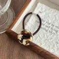 Retro acetate button hair tie with chic tortoise shell circle pendant, elastic hair rope. - Brown Cow Print