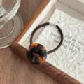 Retro acetate button hair tie with tortoiseshell leopard print design and high elasticity. - Caramel Leopard