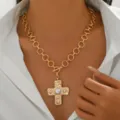 Gold chain necklace featuring a vintage textured cross pendant with faux pearls and an OT clasp. - Gold Pearl Inlaid Necklace