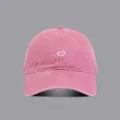 Detail view of the vintage washed pink baseball hat featuring a cute white heart embroidery. - M (56-58cm) / Pink