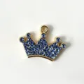 Close-up detail of the glittering blue rhinestone crown pet pendant for stylish dog and cat collars. - Blue Crown