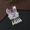 Close-up detail of traditional Chinese Miao silver butterfly tassel pendant craft accessory. - P64