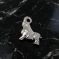 Close-up of silver stainless steel geometric ram pendant showing polished metallic finish. - Silver