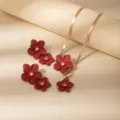 Gold snake chain necklace and red flower earrings set, retro floral jewelry detail view. - X675-Red