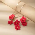 Close-up detail shot of red flower pendants and metallic flat snake chain necklace set. - X678-Rose Red