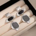 Vintage geometric metal drop earrings with black enamel, long dangle style for women. - Silver Black