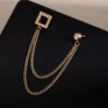 Gold-tone metal brooch featuring crystal-paved square charm and elegant double tassel chains. - Gold Square Rhinestone Tassel Style (Z721)