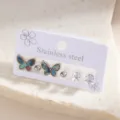 Stainless steel butterfly earring set detail, featuring iridescent shell and crystal studs. - Iridescent Shell Butterfly Stud Earrings Set (E1521-3)