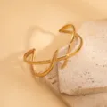 European and American retro irregular geometric hollow gold open bangle bracelet detail shot. - Geometric Intersecting Hollow Style / Gold