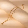 Detailed close-up of the elegant stainless steel gold-plated double-layer heart bracelet charm. - S800
