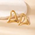Gold geometric hollow earrings detail shot, minimalist metal abstract leaf design for modern women. - E1535-5