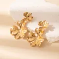 Gold metallic exaggerated leaf earrings, geometric hollow dangle earrings for women detail shot - E1531-6