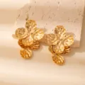 Detailed close-up of statement gold metallic multi-layered flower earrings for women chic. - E1531-7