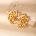 Exquisite hollow gold geometric leaf earrings, vintage statement metal ear studs detail view. - E1531-8