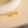 Gold-tone double heart stud earrings with sparkling crystals for elegant daily wear. - E4781
