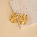 Gold irregular metal earrings detail view, minimalist geometric stainless steel ear studs design. - E4950