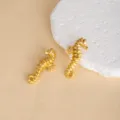 Exquisite gold seahorse metal stud earrings for women, vintage ocean style jewelry detail. - E4740-1