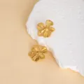 Gold flower metal stud earrings for women, vintage stainless steel chic jewelry detail shot - E4550-1