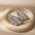 Silver metallic leaf earrings, retro geometric irregular design, chic fashion variant. - E1548-7