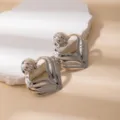 Retro metal hollow leaf ear studs, vintage geometric fashion jewelry for women daily wear. - E1671-4