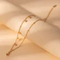 Stainless steel gold tone star crystal charm bracelet detail shot, minimalist fashion jewelry. - S806