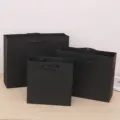Black paper gift bags with black ribbon handles, premium packaging bags for shopping and events. - Gift Bag / Extra Large 33x25x1cm