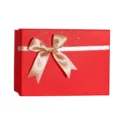 Red gift box with white ribbon and bow, elegant present packaging for holidays and parties. - Festive Red and Gold