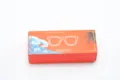 Detailed view of the orange packaging box featuring a stylish tropical sunglasses graphic. - Color Box
