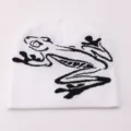 Casual white knit beanie with a stylish black frog jacquard design, warm and trendy. - One Size / Jacquard Toad - White
