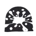 Black and white knit beanie detail, abstract splatter pattern, warm winter wool hat close-up. - One Size / Black Fireworks Pattern