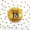 Close-up detail of the gold and black 18th birthday celebration metal pin badge design. - Cheers to 18 Years Style (B) / Black & Gold