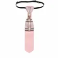 Close-up detail of the pink plaid pre-tied necktie featuring rhinestone and pearl chain. - Pink