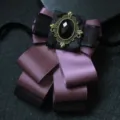 Dark purple ribbon bow tie with gothic bronze gemstone center decor for formal suits. - Deep Purple