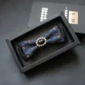 Elegant men's blue jacquard bow tie with sparkling rhinestone center, perfect for formal events. - Skull