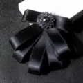 Black satin ribbon bow tie brooch with rhinestone center for men suits and formal wear. - Black