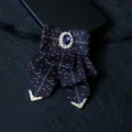Vintage men's navy blue ribbon bow tie with rhinestone centerpiece and gold metal tip details. - Size 11