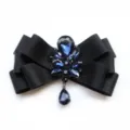 Men's black satin bow tie with sapphire blue rhinestone crystals and a dangling teardrop pendant. - Black