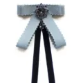 Elegant blue ribbon bow tie with vintage crystal brooch, perfect for school uniforms or office wear. - Blue Pom-Pom Edge