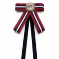 Pre-tied striped ribbon bow tie with crystal brooch and velvet drapes for uniform style. - Black Red White