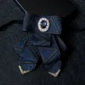 Dark blue geometric patterned men bow tie with crystal rhinestone brooch and gold metal tips. - No. 09