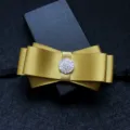 Golden satin bow tie for men, featuring a sparkling rhinestone center and black adjustable strap. - Golden Yellow