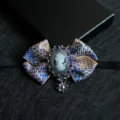 Vintage blue and gold plaid bow tie with cameo brooch, elegant retro collar flower accessory. - Symmetrical Black (07)