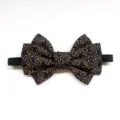 Detailed close-up view of the exquisite blue and gold patterned bow tie with elastic strap. - Snowflake Yellow