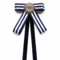 Navy blue striped bow tie with crystal rhinestone brooch for school uniform and professional wear. - Blue and White Stripe